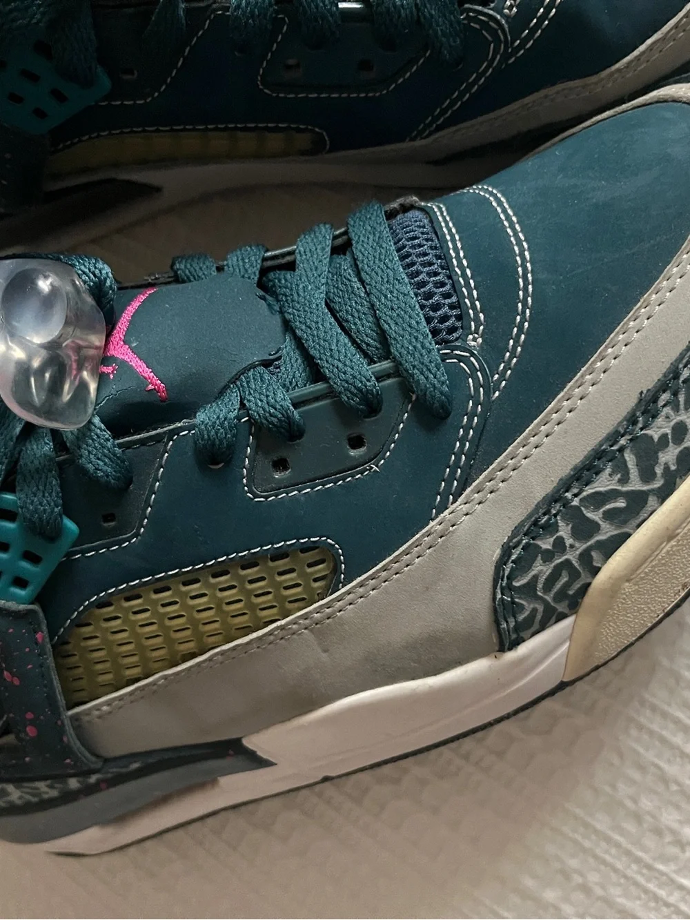 Jordan Spizike Space Teal and Gray Sneakers with Pink Accent.